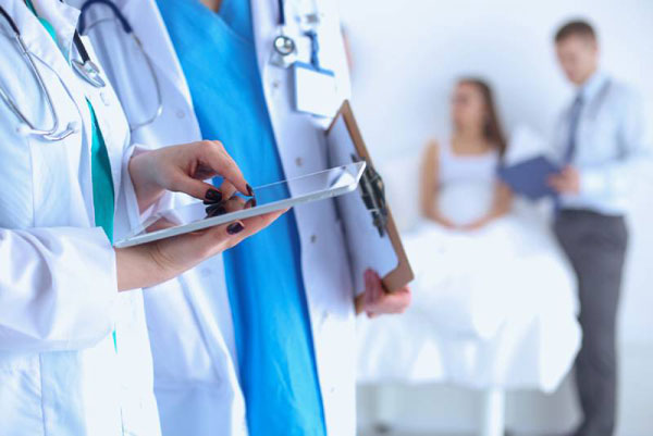 1605601586891876.jpg Young-woman-doctor-holding-a-tablet-pc.jpg